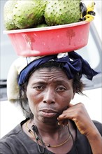 Market woman carrying fruit on her head