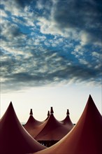 Circus tents and an evening sky