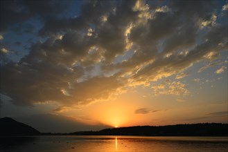 Sunset with clouds above Lake Klopeiner See