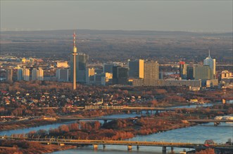 The city of Vienna and the New Danube river at dusk