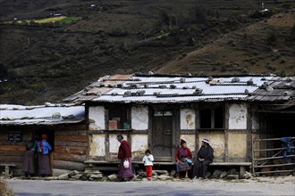 Small shop on the roadside with people out the front