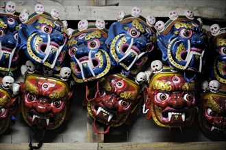 Traditional religious masks in a chamber of Mongar Dzong fortress