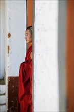 Monk in a courtyard of Punakha Dzong fortress