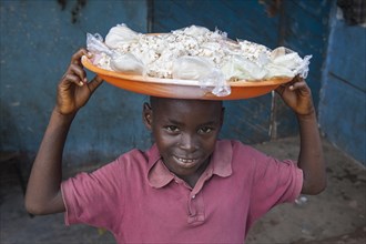 Young popcorn seller at a street market