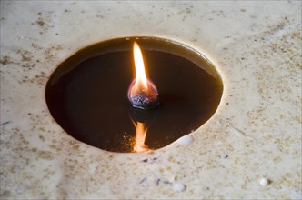 Flame burning inside a big butterlamp