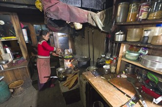 Local woman working in a typical Nepali kitchen