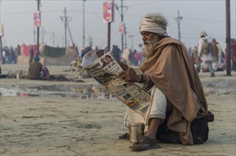 Pilgrim reading newspaper in the morning