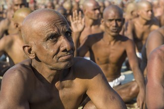 Man joining the initiation of new sadhus
