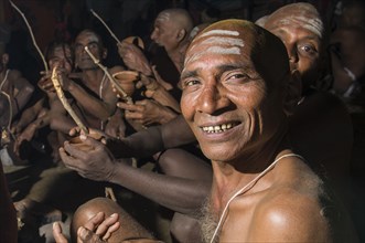 Man joining the initiation of new sadhus