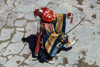 Monk performing ritual mask dance