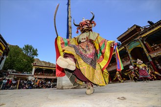 Monk performing ritual mask dance