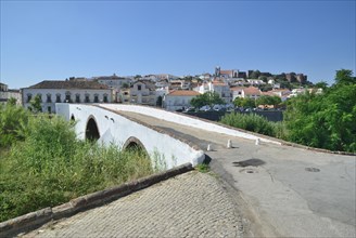 Old stone bridge crossing the Rio Arade river