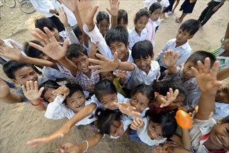 Children stretching their arms up