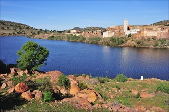 Small village with a mosque and a reservoir
