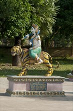 Tiger sculpture with riders as a symbol of the third of the twelve earthly branches in the Chinese calendar in a Buddhist monastery