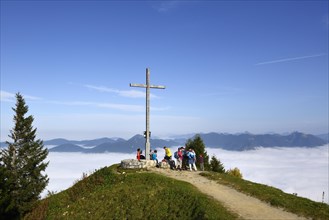 Hikers at the summit cross