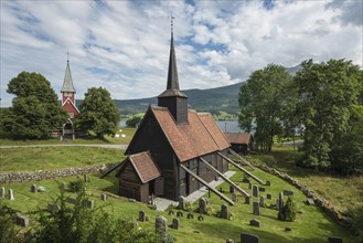 Stave Church with external supports in the fjord landscape