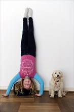 Girl doing a headstand