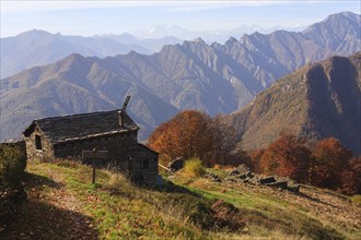 Bivacco Alpe Curgei mountain hut in autumn