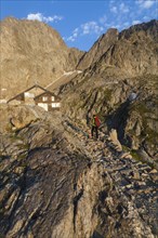 Hiker at Rifugio Pagari mountain hut