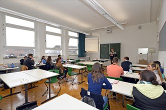 Young trainee teacher teaching a class