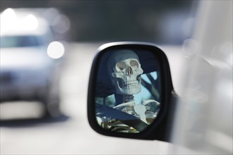 Skeleton at the wheel of a car