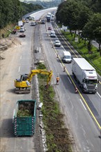 Construction and slow-moving traffic on a motorway construction site on the A52 motorway