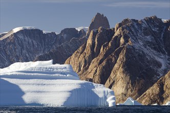 Iceberg in front of the mountain scenery of Øfjord