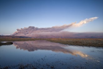 Ash cloud from the Eyjafjallajoekull volcano at sunset