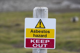 Warning sign "Asbestos hazard - keep out" at the Stromness whaling station