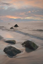 Stones on the beach at sunset
