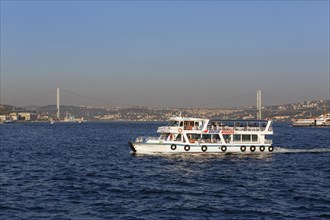 Ferry on Bosphorus with Bosphorus Bridge