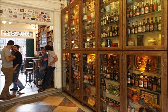 Various beer bottles in display cabinets