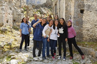 Group of schoolgirls in a formerly Greek ghost town