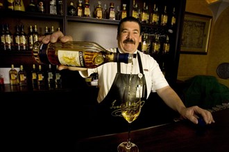 Bartender pouring a tequila