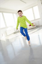 Young jumping rope in casual clothes