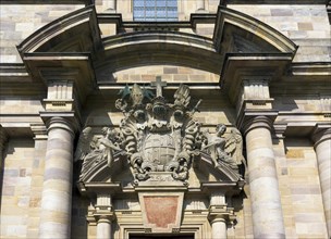 Two angels holding the coat of arms of Prince-Abbot Adalbert von Schleifras above the main entrance of St. Salvator Cathedral of Fulda