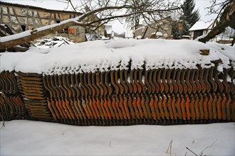 Roof tiles stacked in the snow