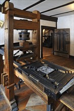 Relief printing press for printing woodcuts