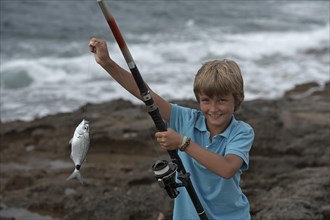 Boy with a caught fish