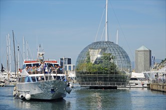 Excursion boat in front of the glass sphere "Biosfera"