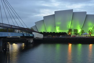 Illuminated Clyde Auditorium with the Bell Bridge on the River Clyde