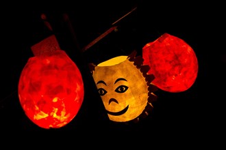 Paper lanterns lit by candles