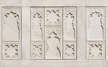 Marble slabs carved with blind arcading