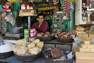 Friendly-looking grocer at the market