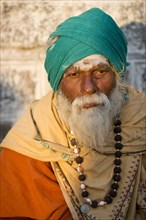 Sadhu or wandering ascetic with rudraksha beads and a green turban