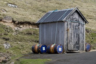 Barrels filled with sand to keep the hut on the ground in high winds