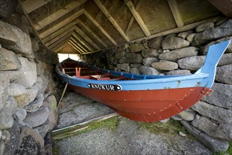 Traditional boat in a shed