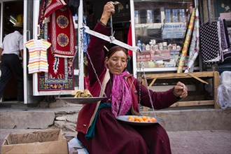 Woman selling apricots