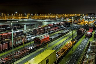 Parked goods wagons on the tracks of the Maschen marshalling yard at night